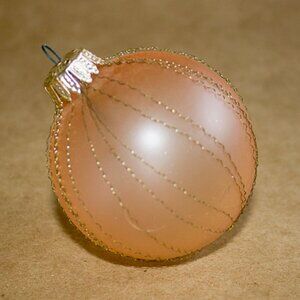 light pink colored ball ornament